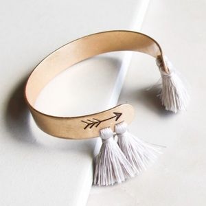 NWT Entourage Gold adjustable cuff bracelet with gray/silver tassels on the end